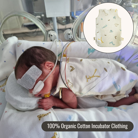 Premature newborn in NICU wearing organic cotton incubator clothing – soft and breathable design